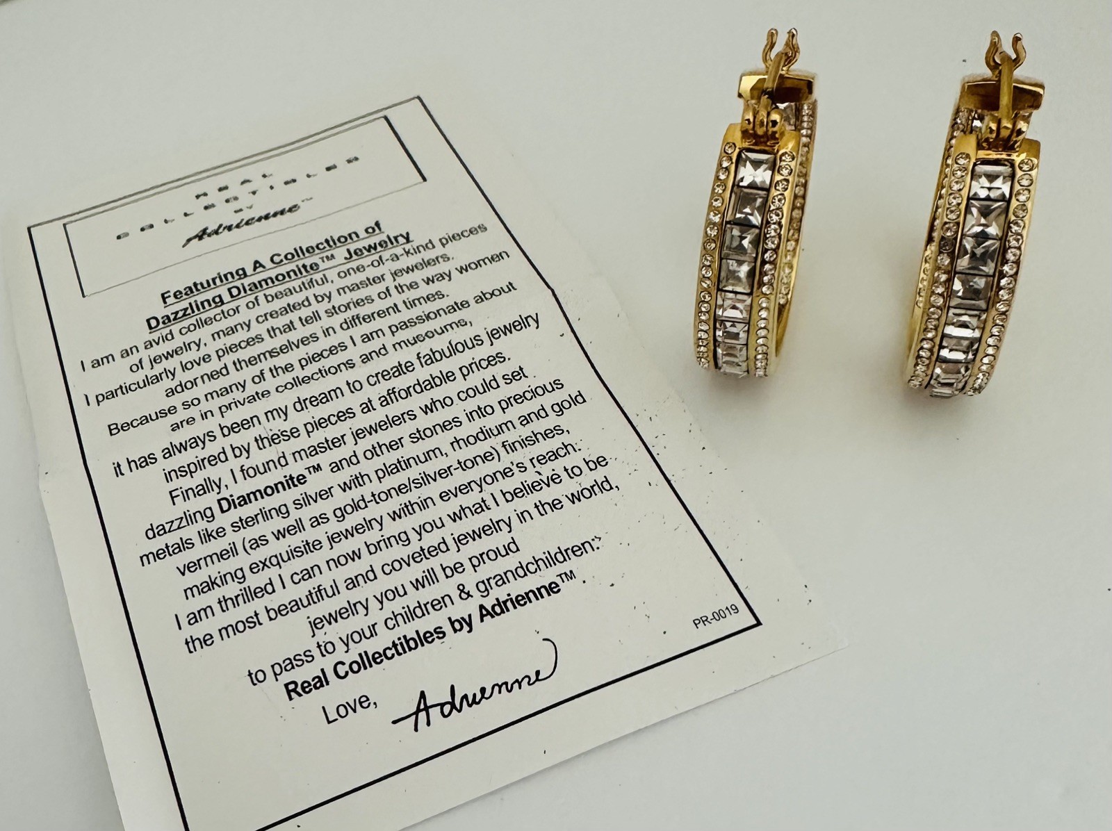 REAL COLLECTIBLES BY ADRIENNE Gold Tone Rhinestone Round Earrings 1”