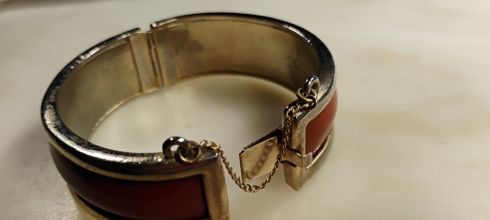 bergere goldtone hinge cuff bracelet inlaid w/soft redish brown material-nd6