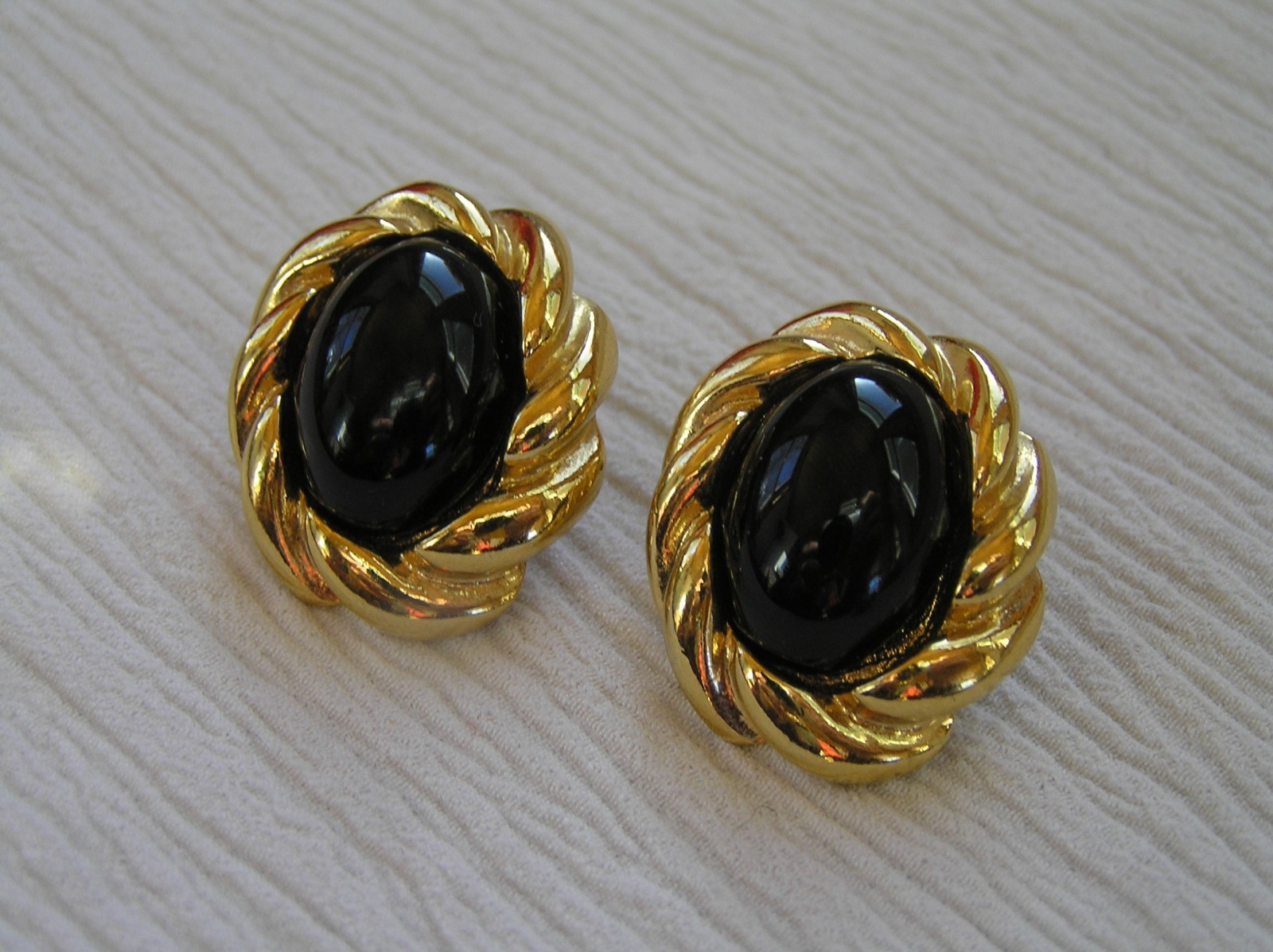 Estate KJL Signed Twist Oval Goldtone with Magnetic Black Plastic Cab Post Ear