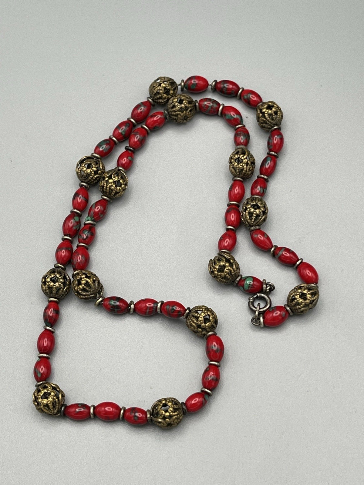 Vintage Red Glass Bead Necklace with Ornate Brass Filigree Accents