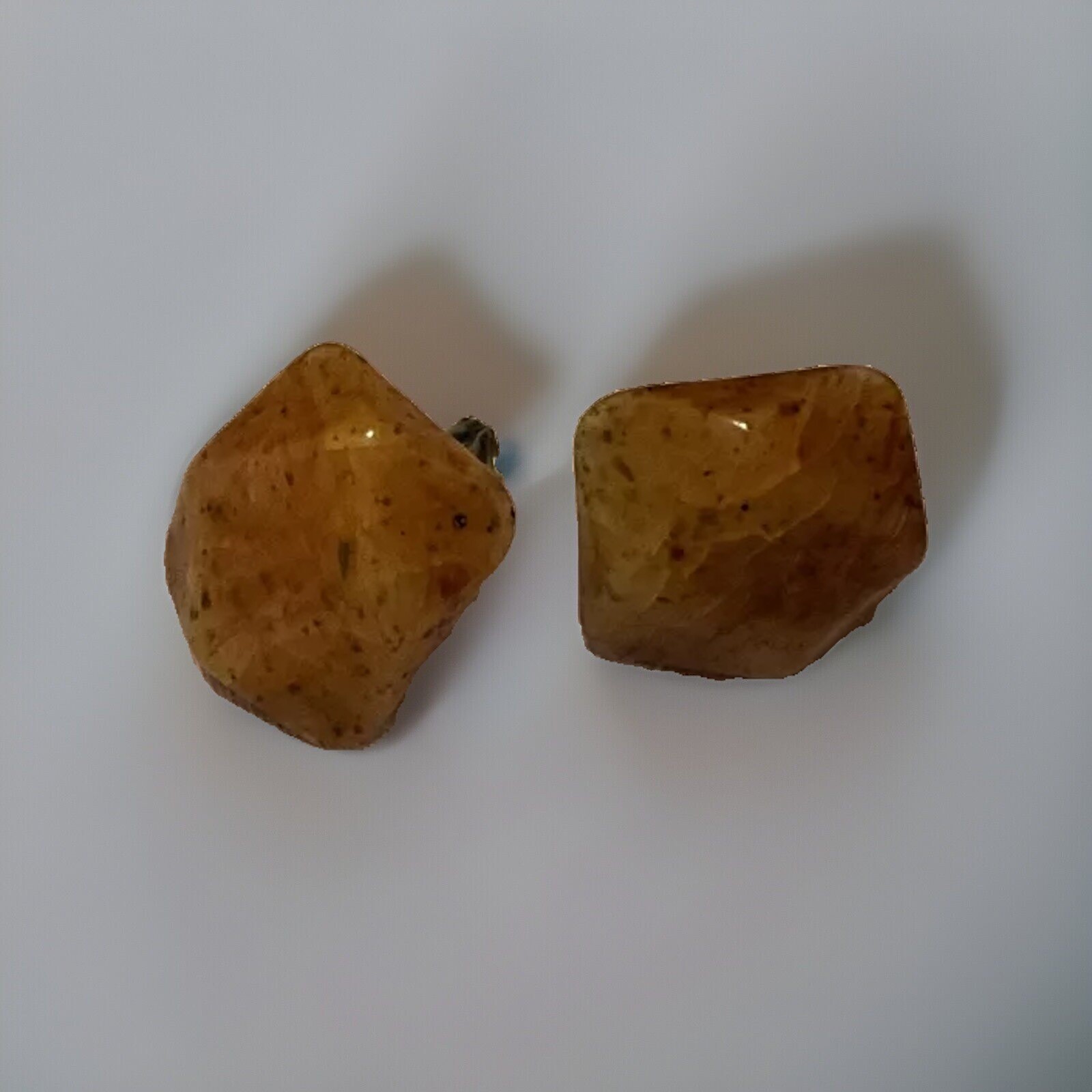 Bakelite Carved Apple Juice Clip On Earings About I 1/4 Inch Across 3/8 Thick.