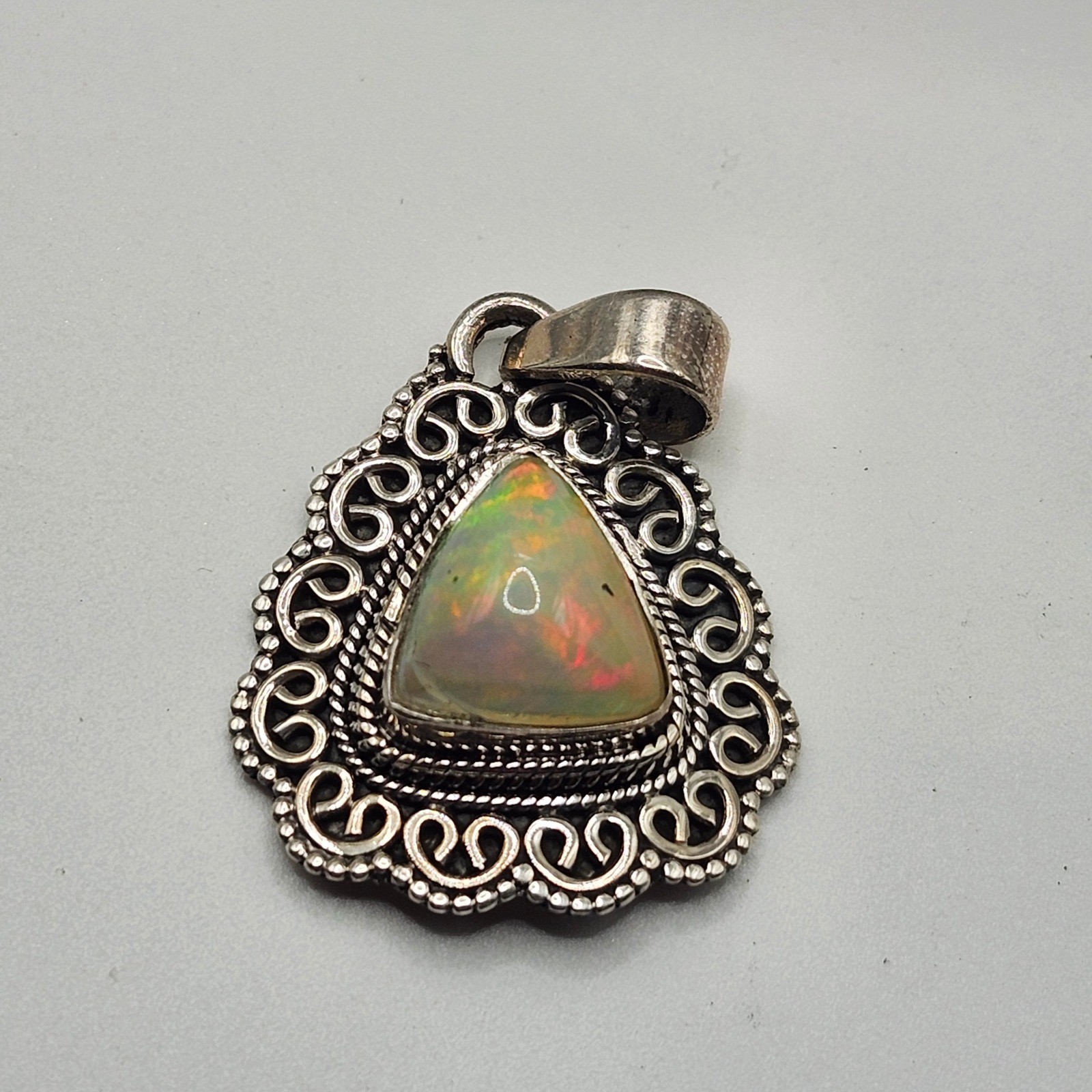 Vintage 925 Sterling Silver Ethiopian Opal Trillion Filigree Pendant