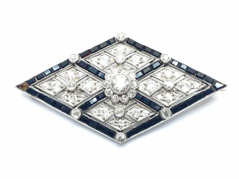 Lozenge Shape With Round Cut Cubic Zirconia & Calibre Cut Onyx Border Brooch