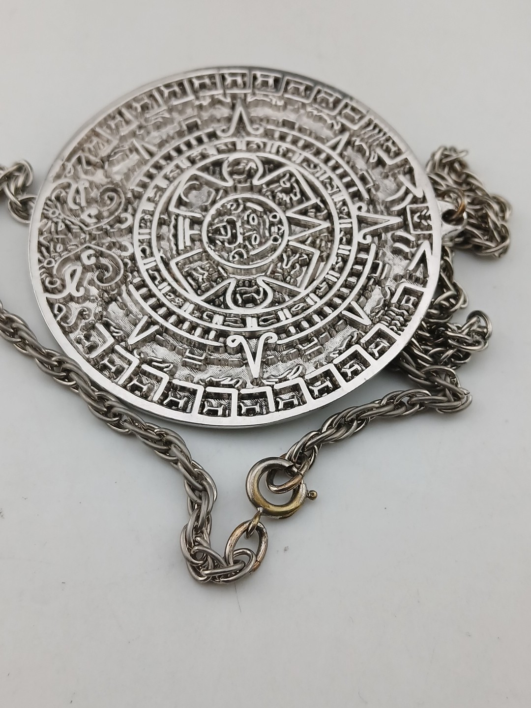 TORTOLINI 1960s silver tone Aztec Calendar textured design medallion necklace