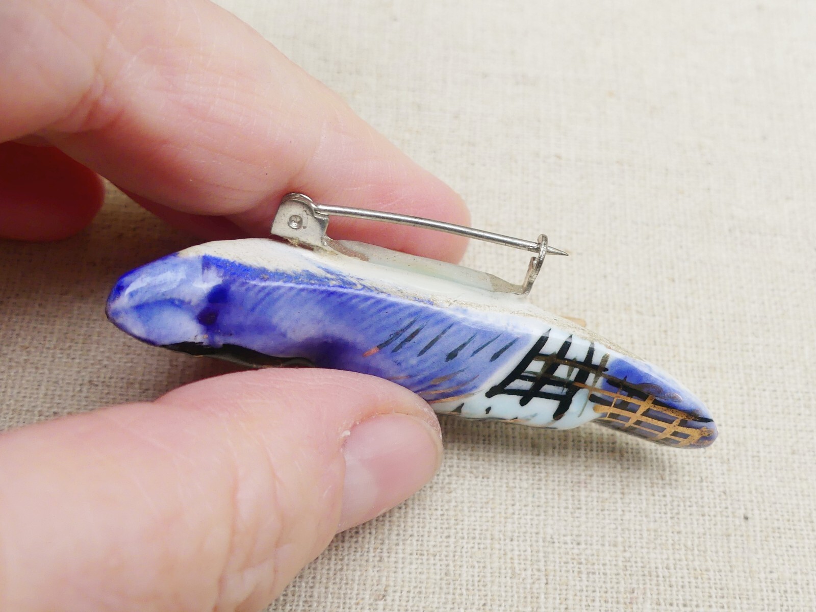 Vintage ceramic blue jay brooch on wood branch bird hand-painted gilt porcelain