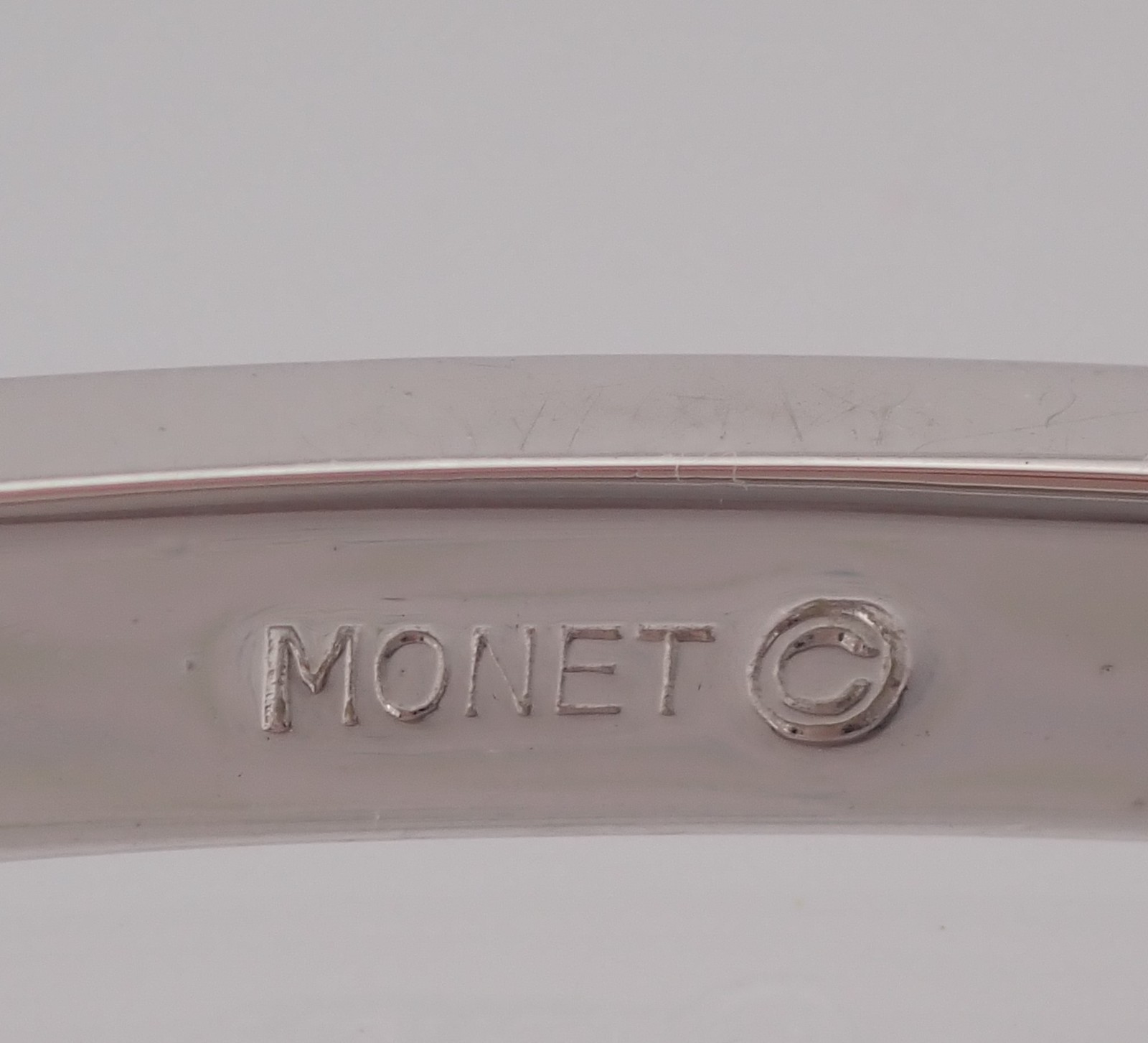 Vintage Monet Oblong Tension Close 6 1/2″ Hinged Silver Tone Bangle Bracelet
