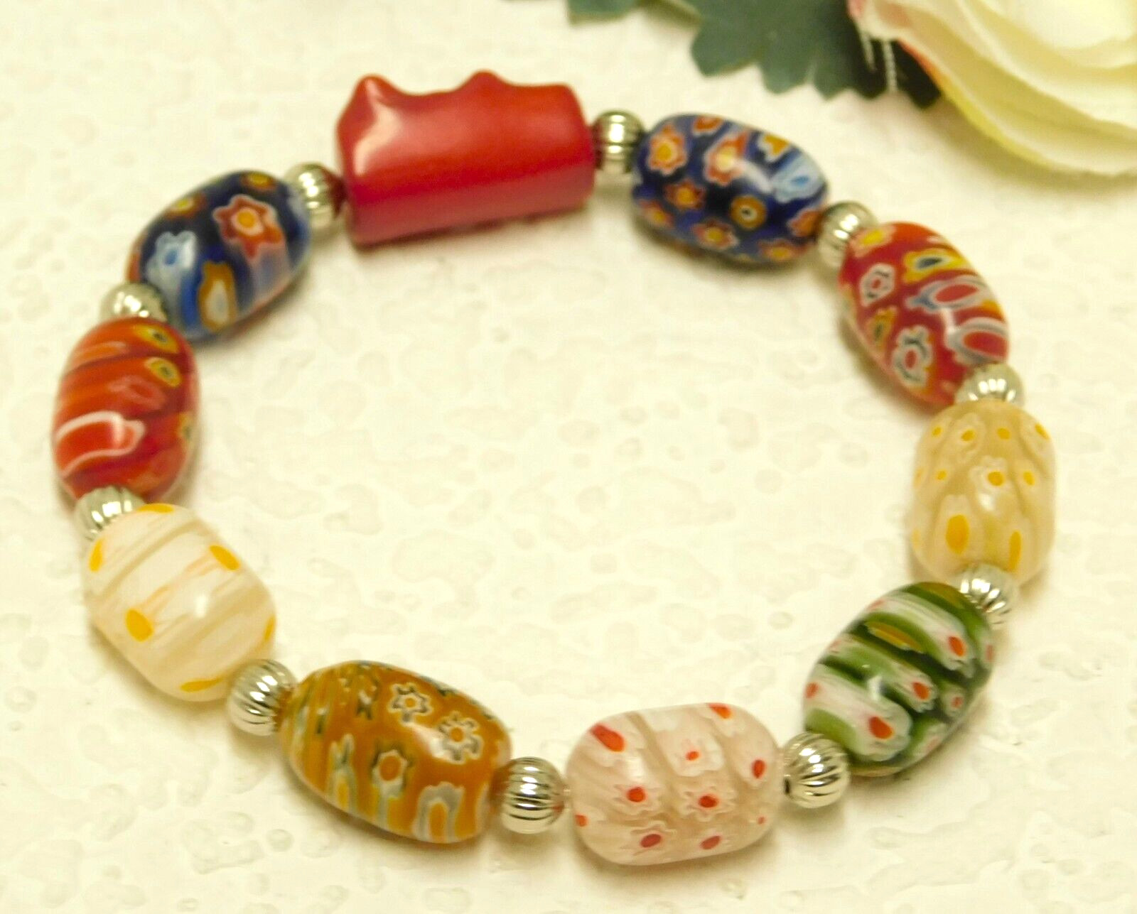 RED CORAL, GLASS MILLEFIORI BARREL BEAD SILVER TONE ACCENTED STRETCH BRACELET