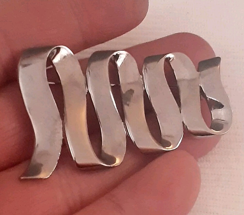 Vintage M Jent polished silvertone Swirl ribbon design Brooch/pin