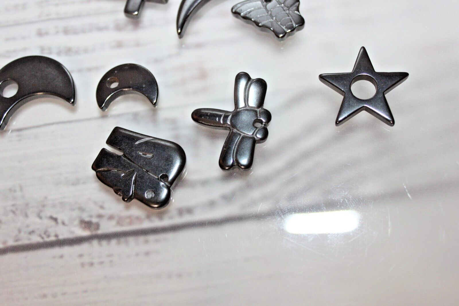 Lot of 8 Hematite pendant charms butterfly star moon dragonfly and more