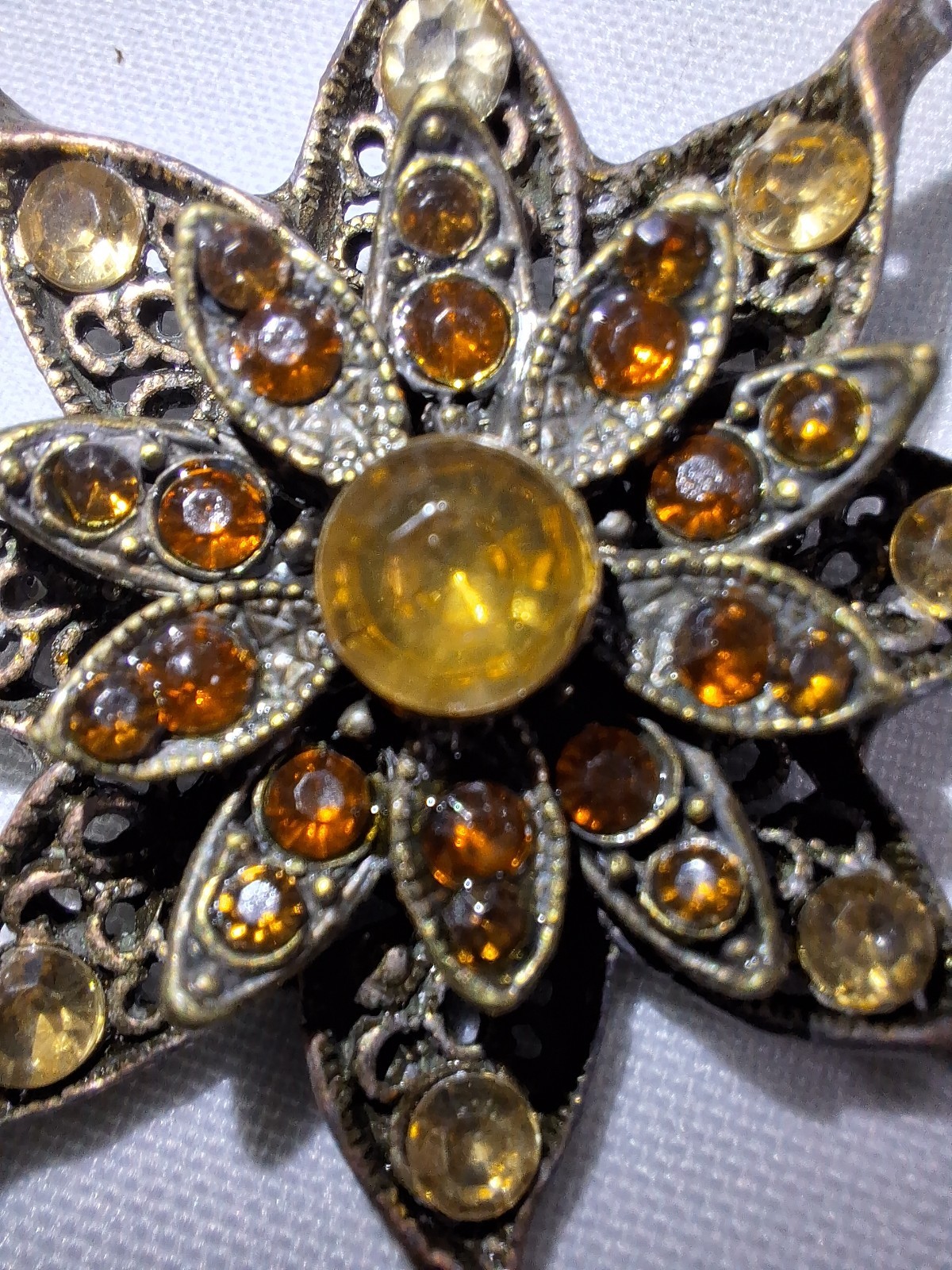 Brass Tone 8 Pointed Star Brooch With Topaz & Amber Stones