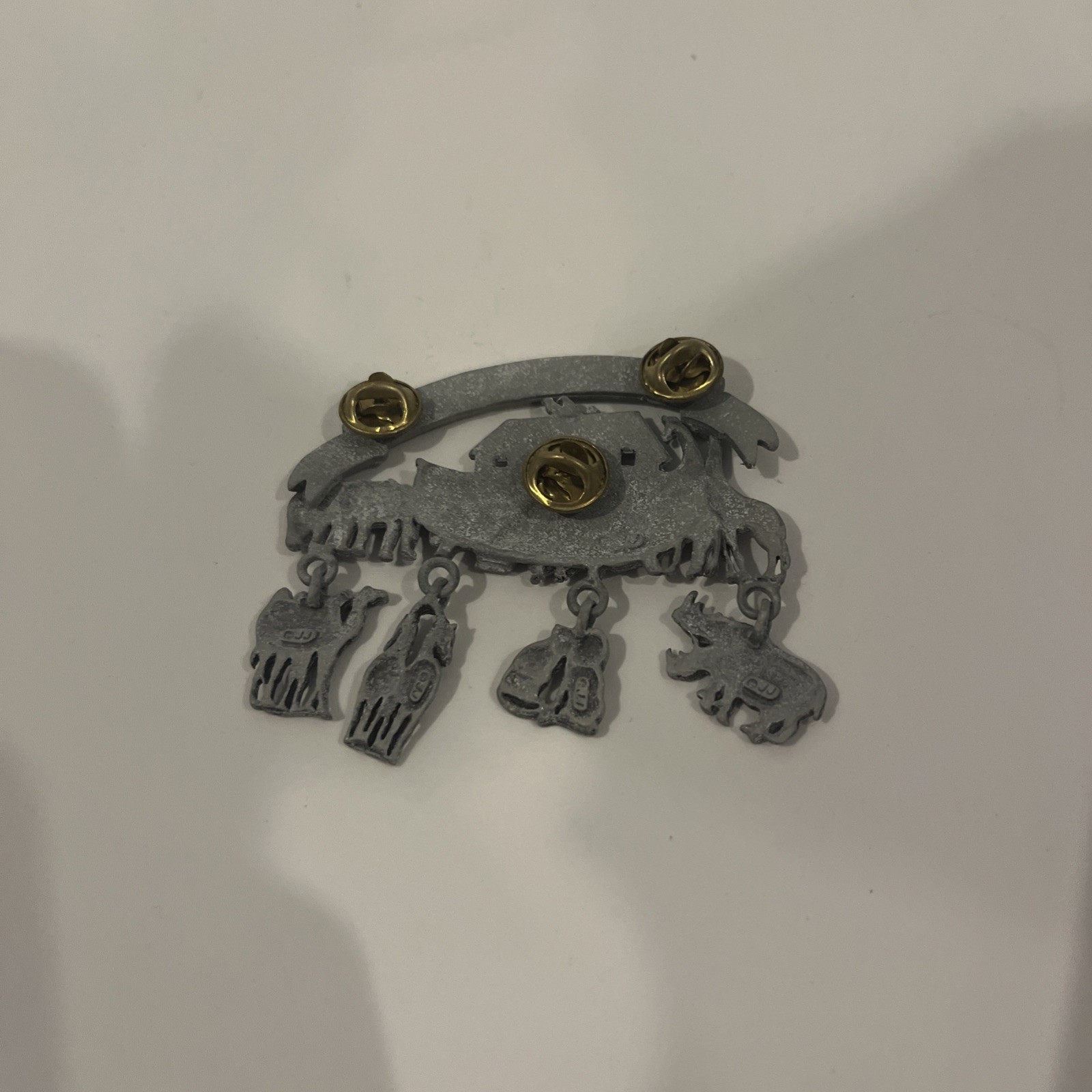 JJ pewter Noah’s Arc pin (brooch) measures approximately 2 3/4”wide