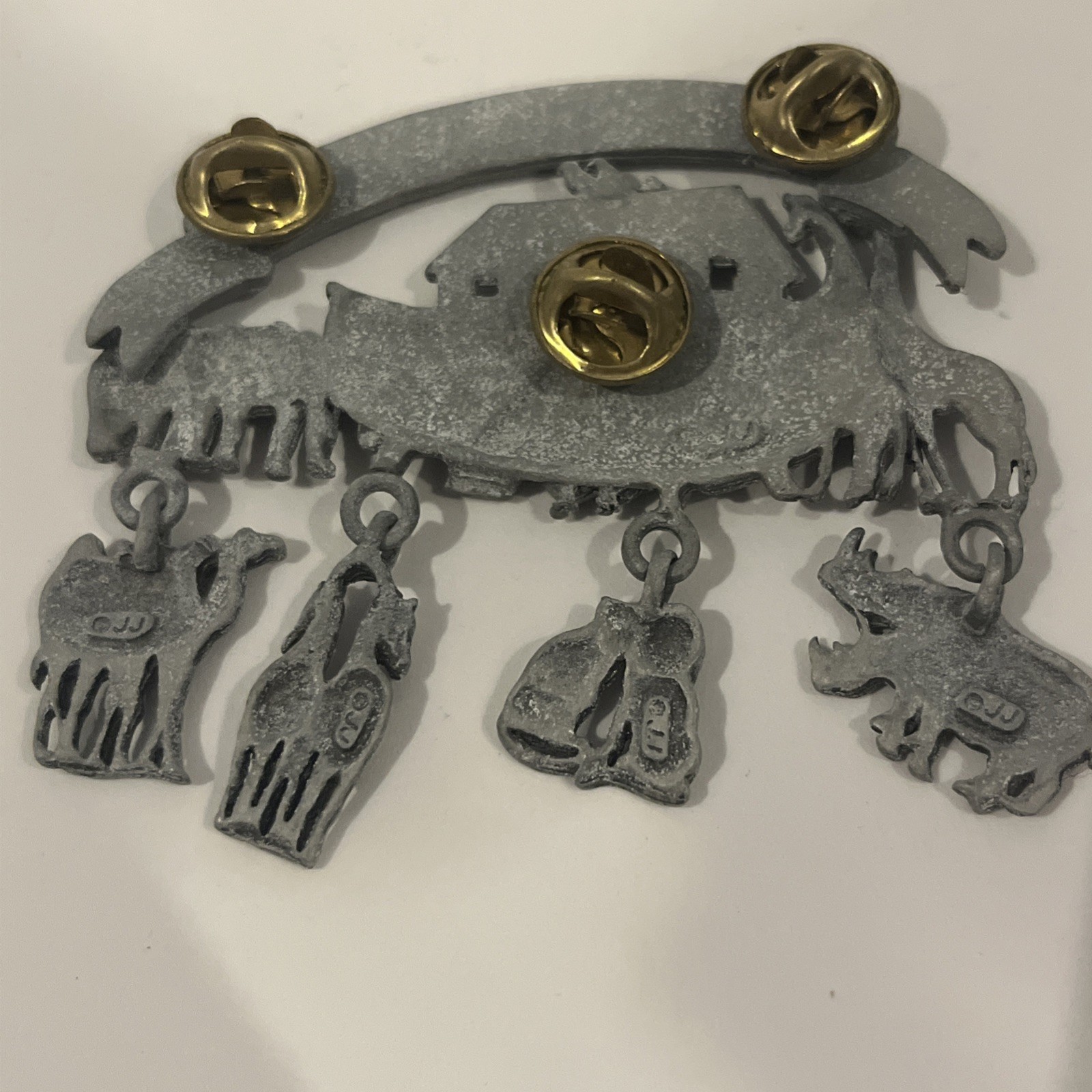 JJ pewter Noah’s Arc pin (brooch) measures approximately 2 3/4”wide