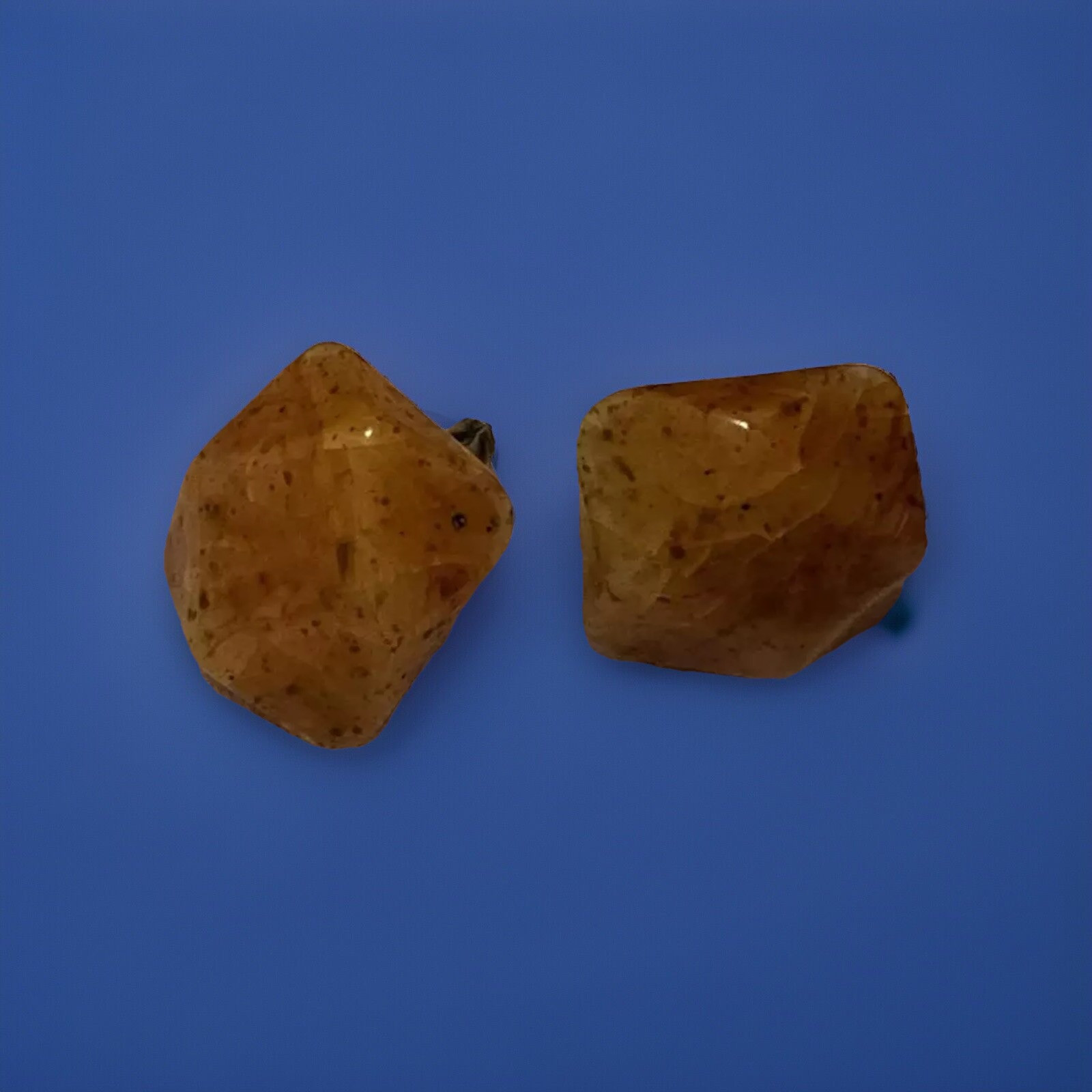 Bakelite Carved Apple Juice Clip On Earings About I 1/4 Inch Across 3/8 Thick.