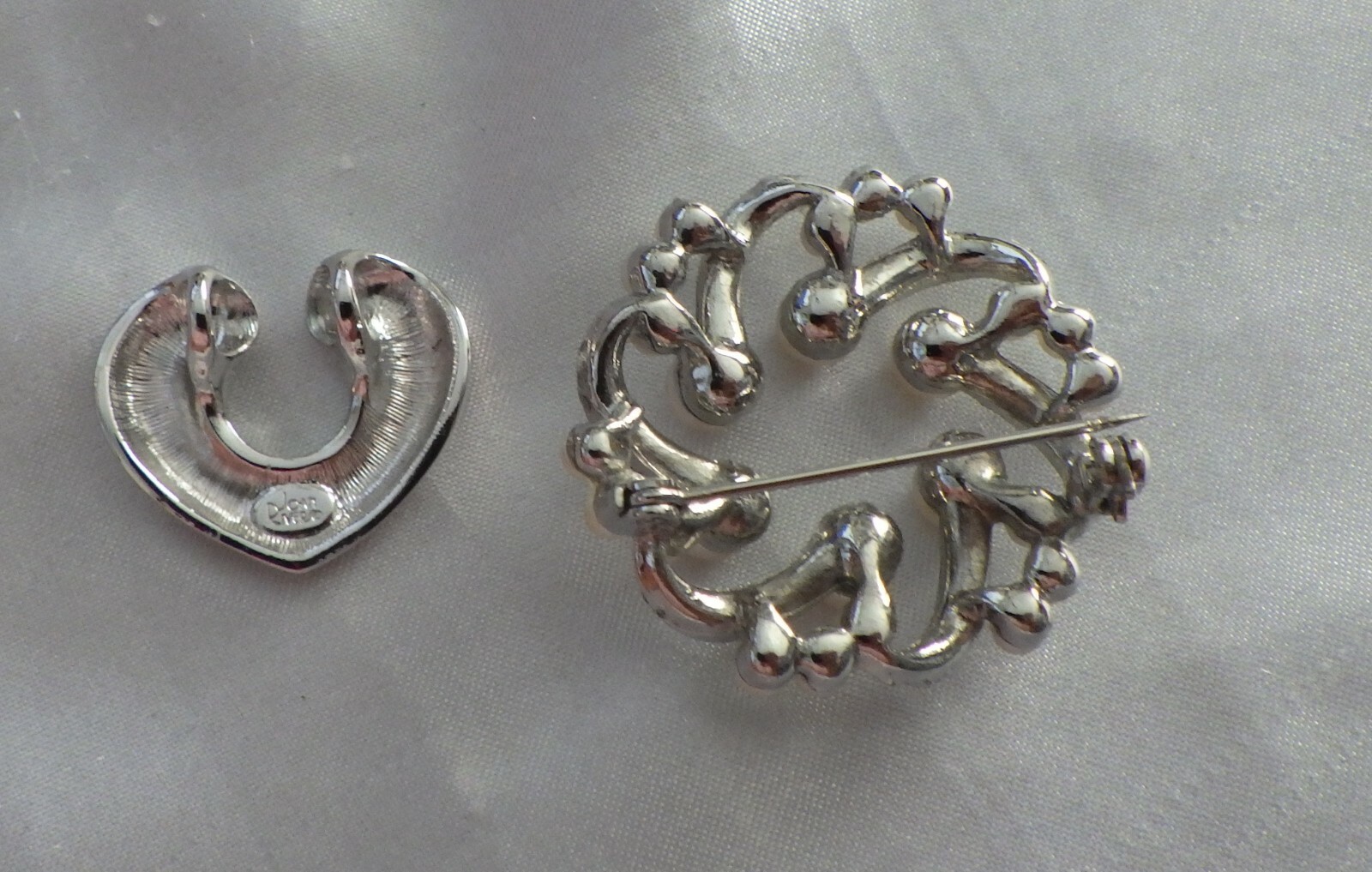 TWO ITEMS FOR AUCTION, JOAN RIVER PENDANT SILVER TONE 1″ & PEARL BROOCH ON SILVE