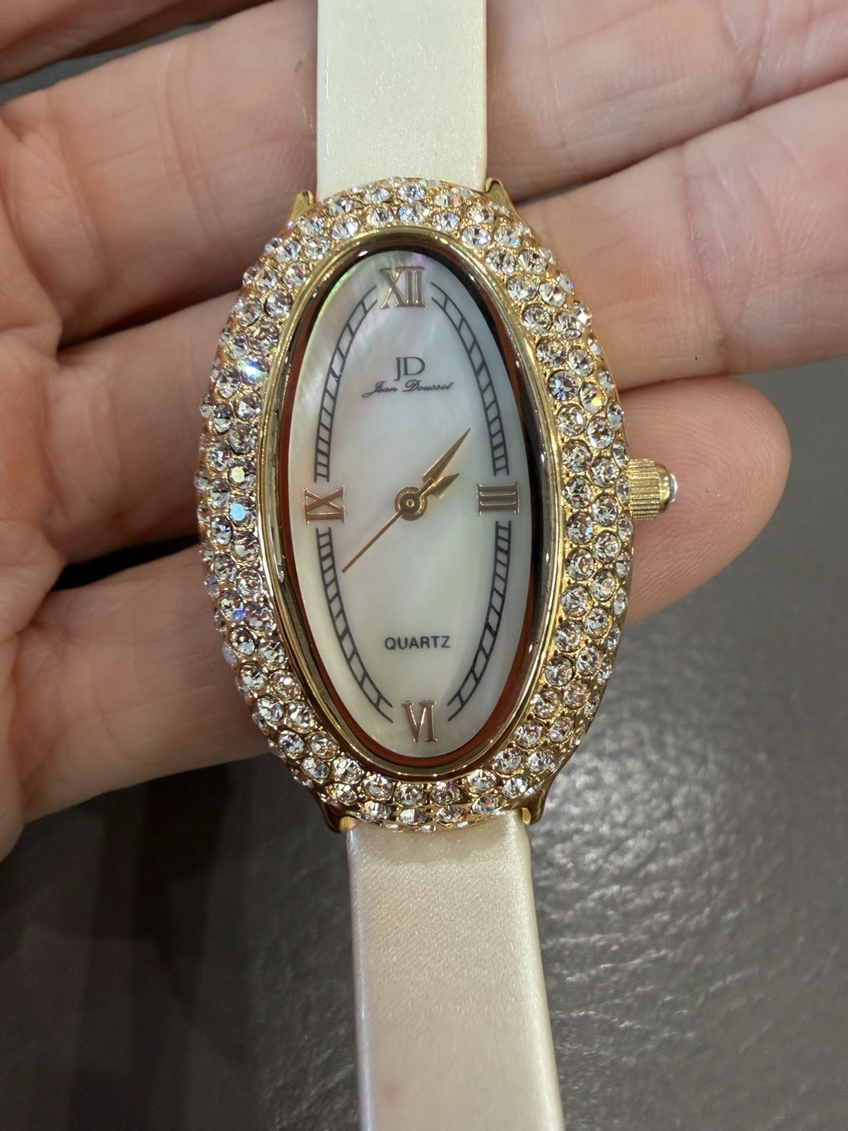 Vintage Jean Dousset Leather, Rhinestone Watch With Beige oval face.