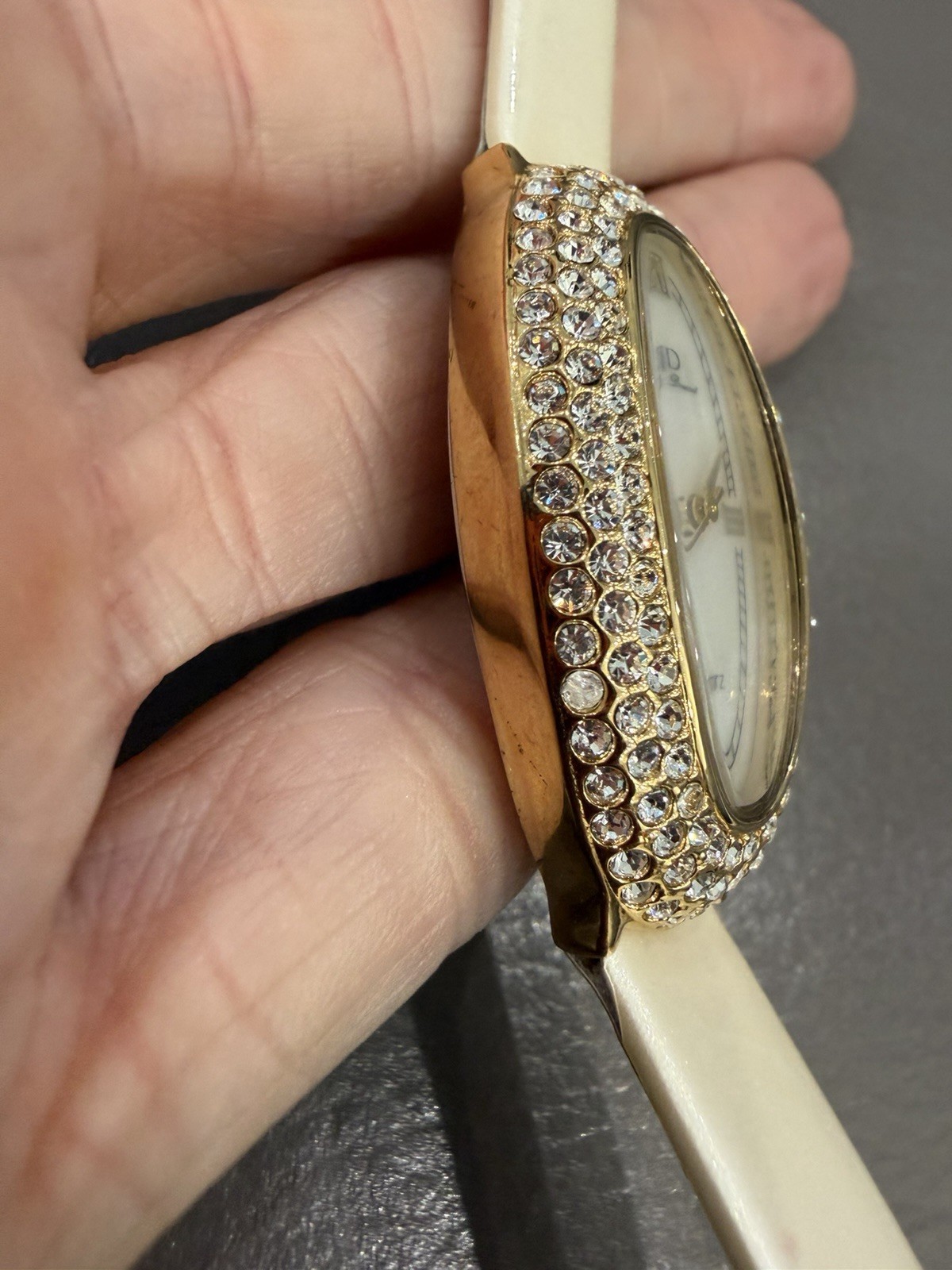 Vintage Jean Dousset Leather, Rhinestone Watch With Beige oval face.