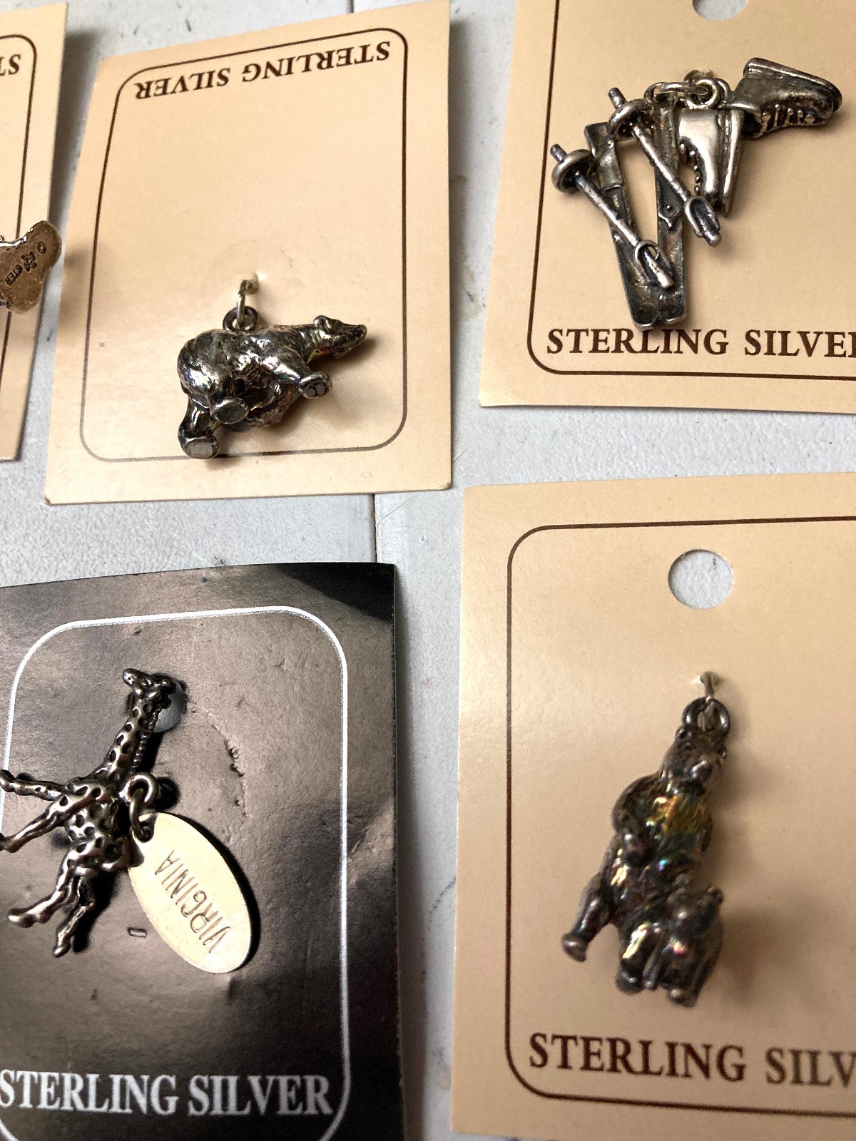VINTAGE (10 ) DIFFERENT STERLING .925 CHARMS STILL ON CARDS N.O.S.