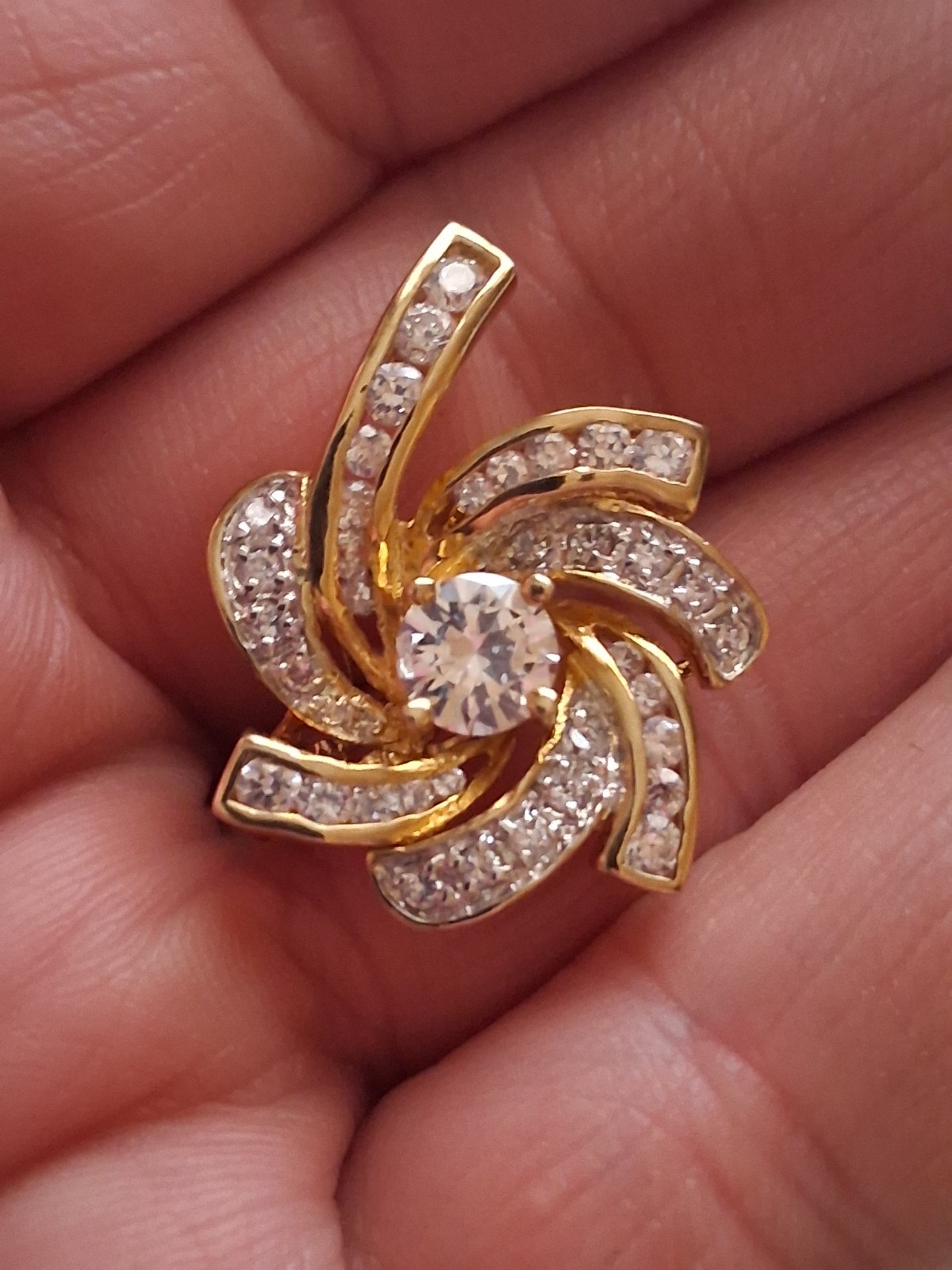 Pinwheel cubic zirconia embellished gold plated convertible brooch/pendant