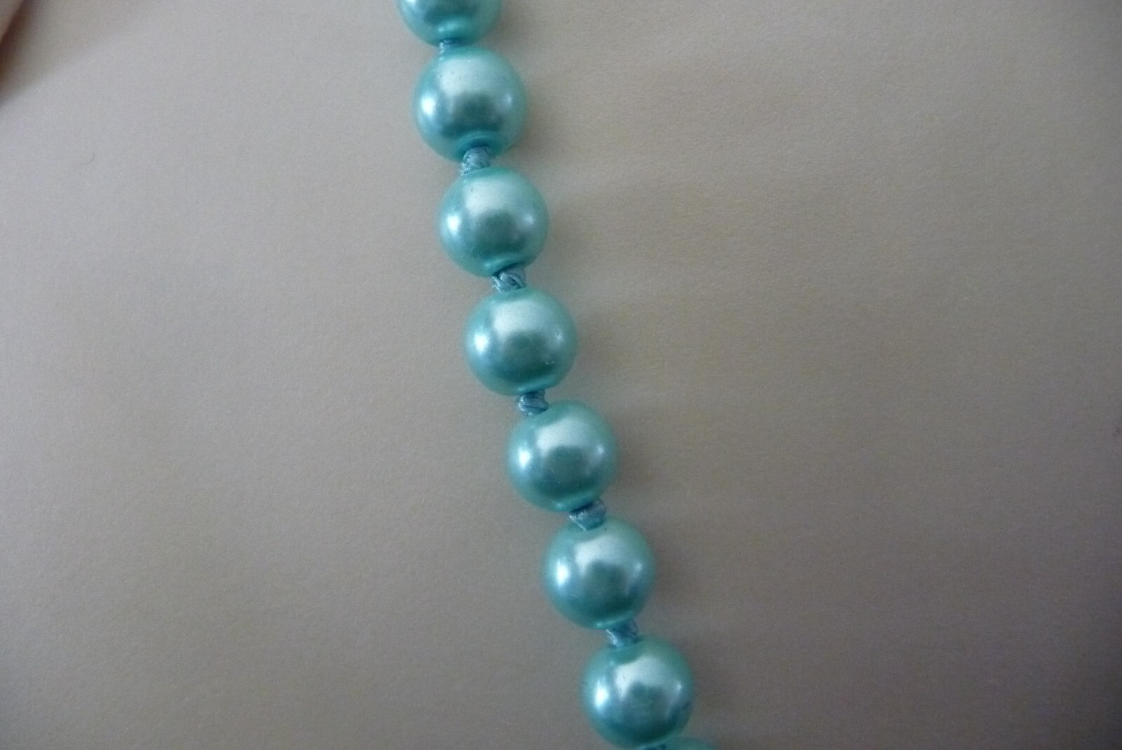 #1721A NECKLACE 28″L NO CLASP HAND KNOTTED AQUA BLUE FAUX PEARL BEADS