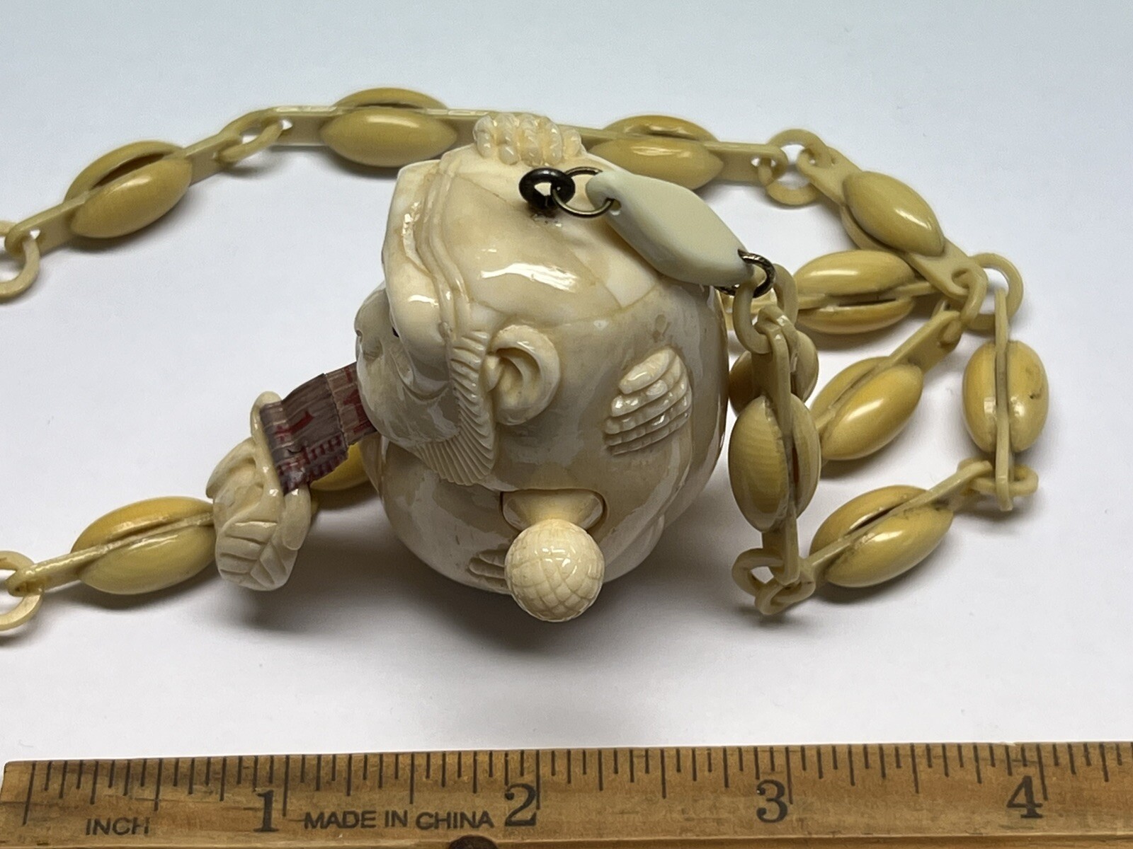 ANTIQUE ART DECO MONKEY NECKLACE TAPE MEASURE CELLULOID CHAIN PENDANT WHIMSICAL