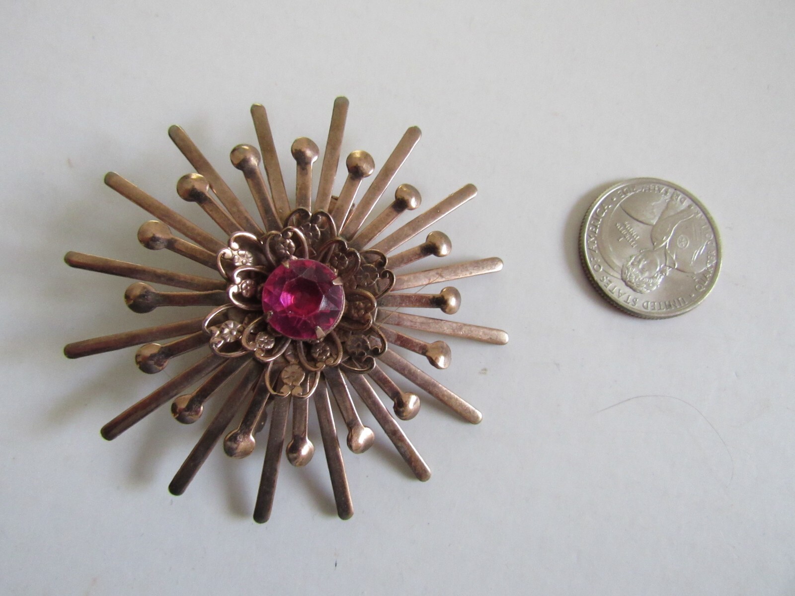 Unbranded Rose Gold Color Starburst Brooch / Pin w Pink Center Stone Vintage