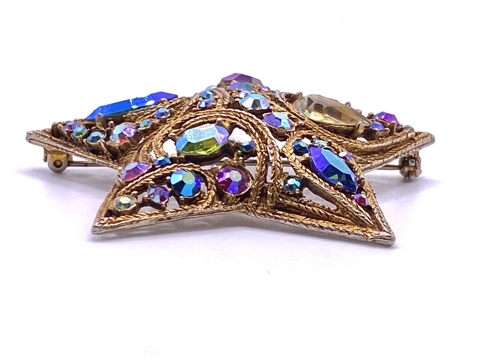 La Roco 1950s Star Brooch Colorful Gold Tone Rhinestones Textured Gold Plate