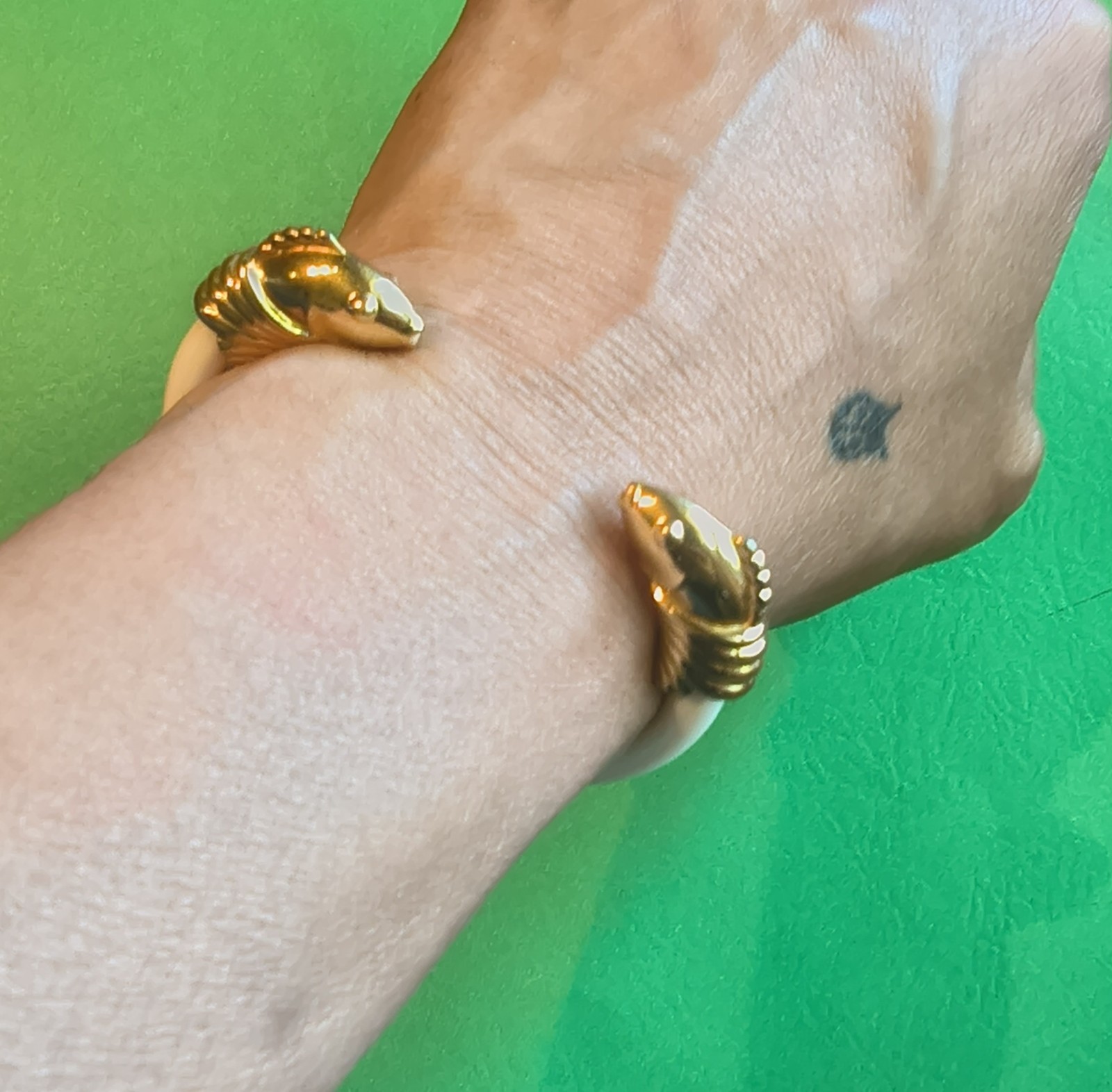 Signed Monet vintage bracelet with a bright gold-tone finish.
