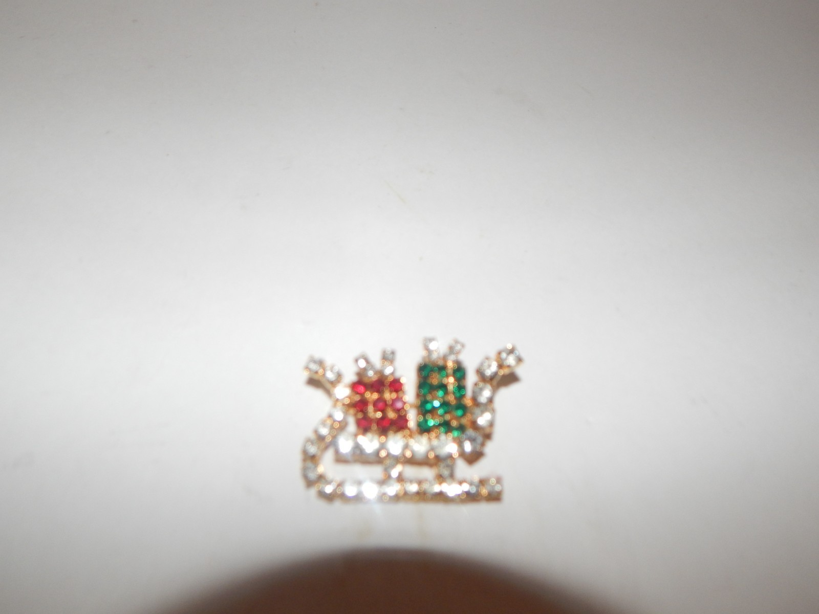 Vintage Gold Tone Green Red Rhinestone Present Holiday Sleigh Pin Brooch