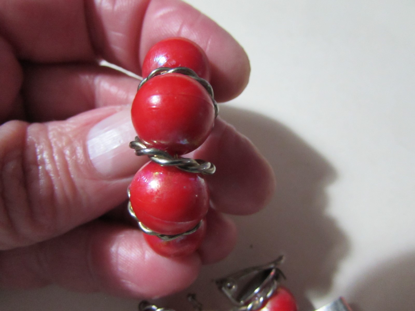 VINTAGE goldtone clip earrings almost 1 1/2″ long red bead half hoop