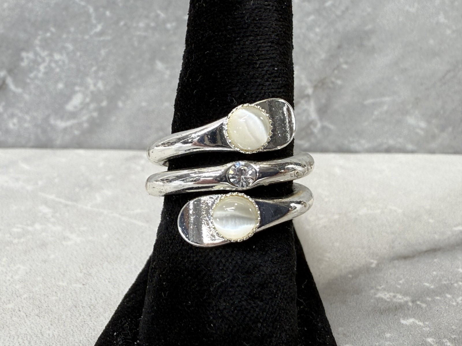 Silver tone wrap with white cat eye and righnstone ring size 6