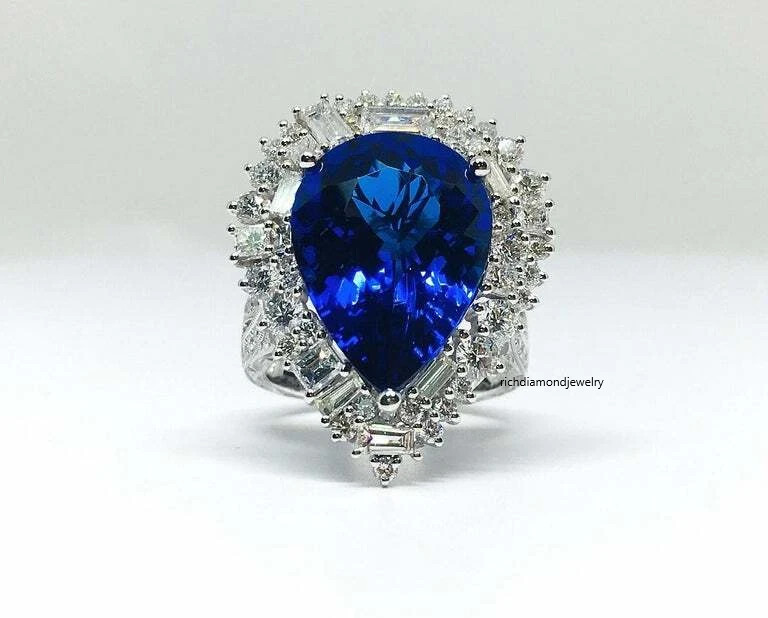 Beautiful Pear Shape 13.24CT Tanzanite & Different Shapes 3CT Shiny CZ Halo Ring