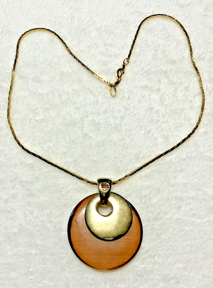 Vintage Brown Acrylic Disc Pendant with a brown rhinestone and Gold Tone Chain