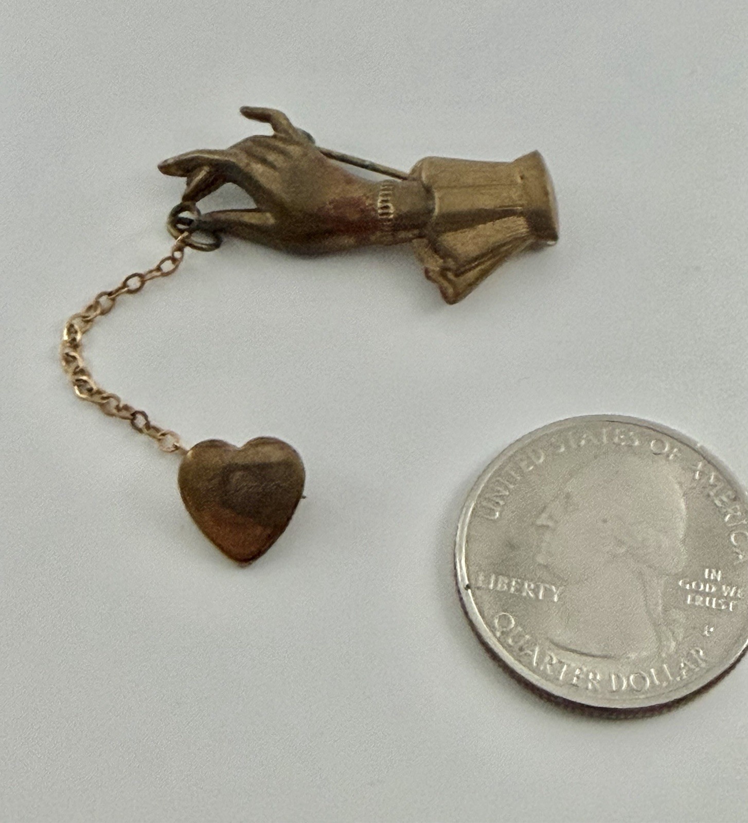Antique Victorian Brass Hand Holding a Dangling Engraved Mini Heart Pin Brooch