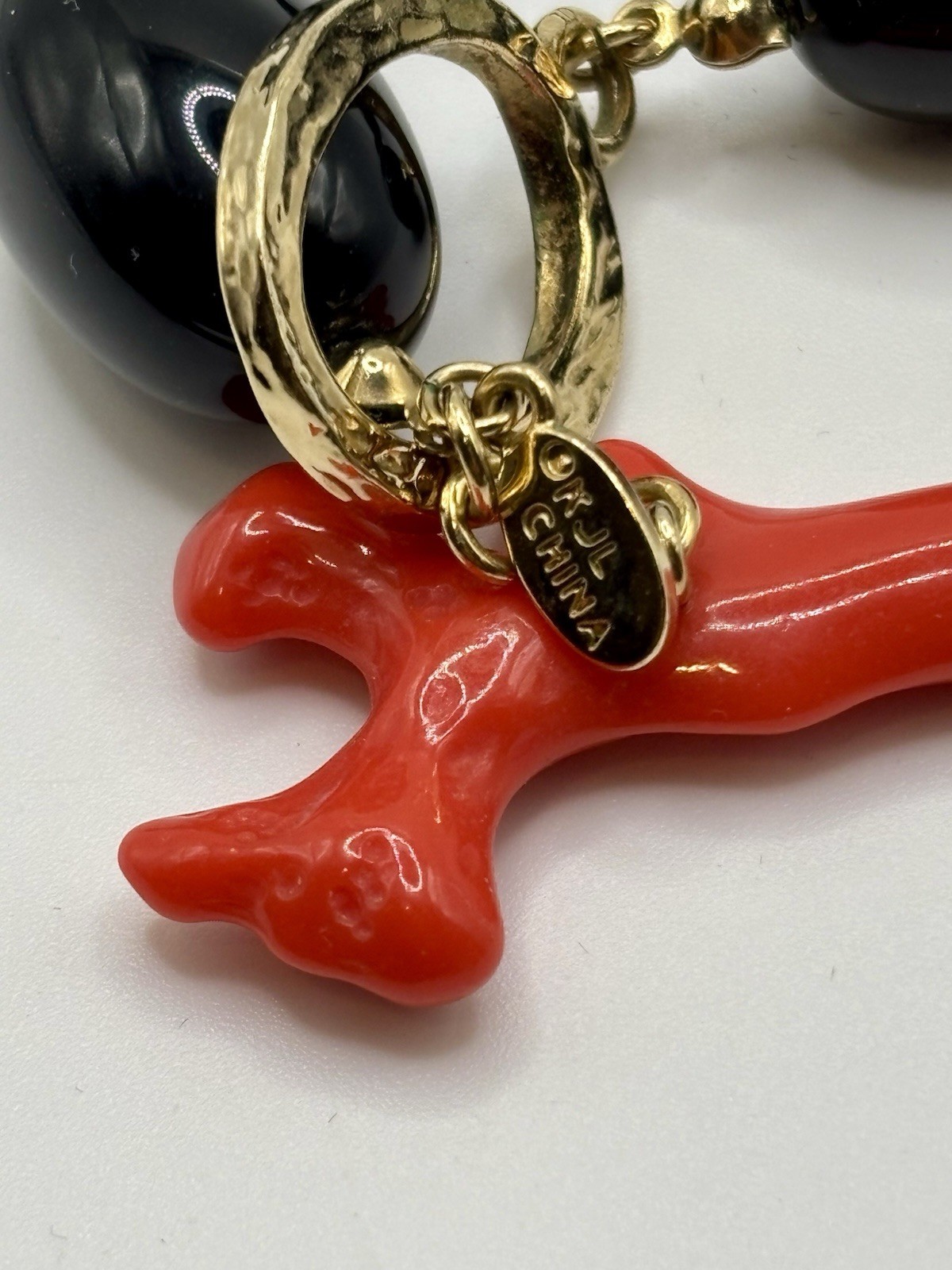 Kenneth Jay Lane ‘Andros’ necklace black lucite beads faux coral toggle closure.