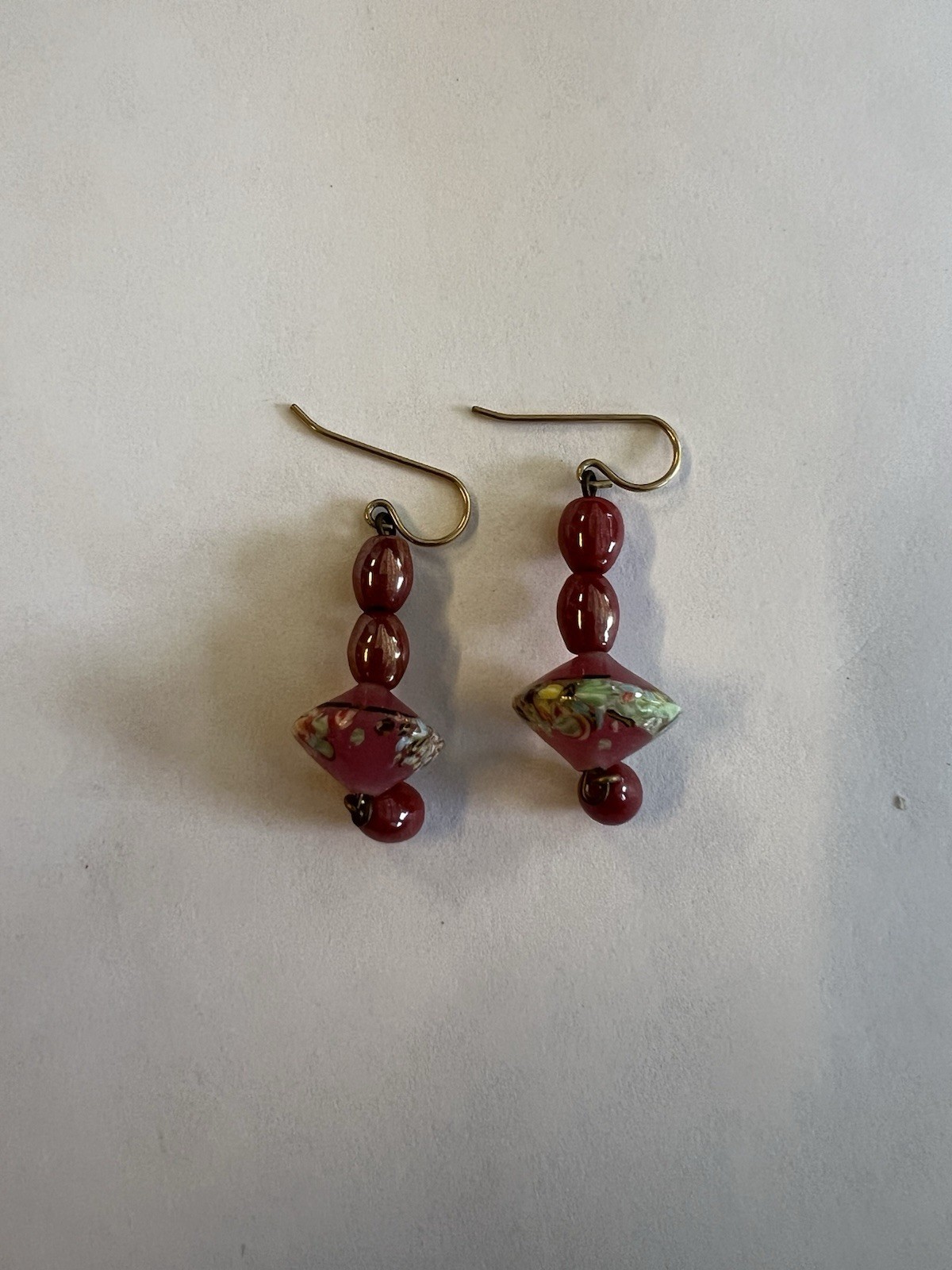 vintage-style dangle earrings featuring pink and green art glass beads