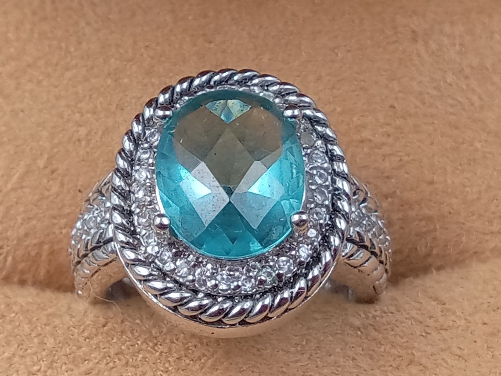 Sterling Silver Ring w. Blue Topaz Oval Center Stone & Clear Trim Stones: Size 6