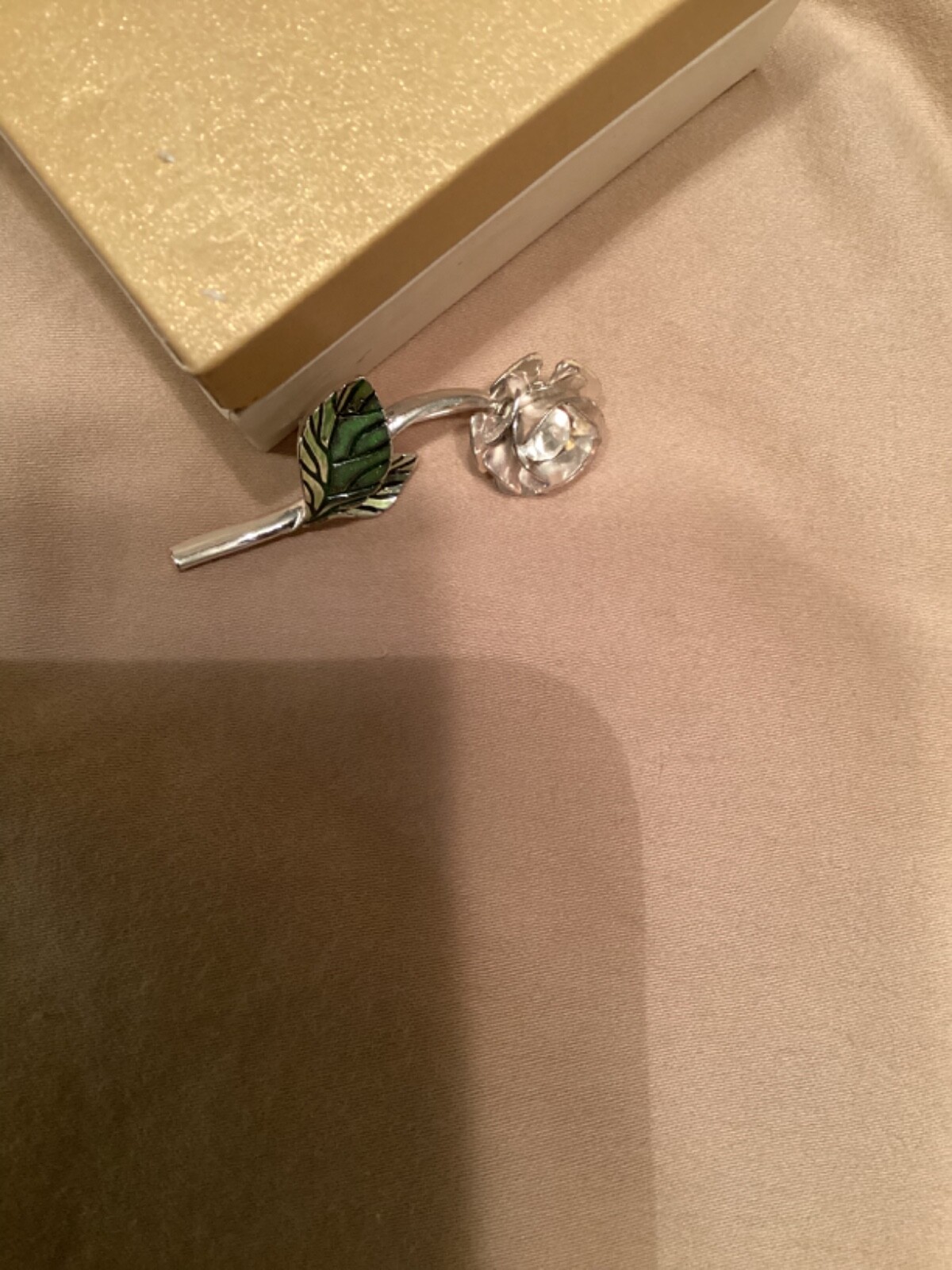 Avon vintage pin clear looking center with green leaves small almost 2” detailed