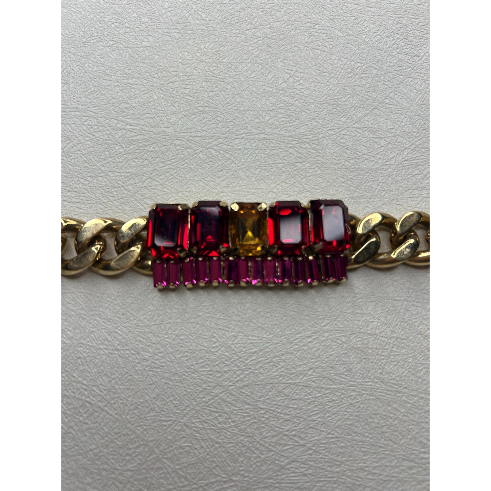 Coach Gold-Tone Curb Chain Bracelet with Fuchsia and Red Rhinestones
