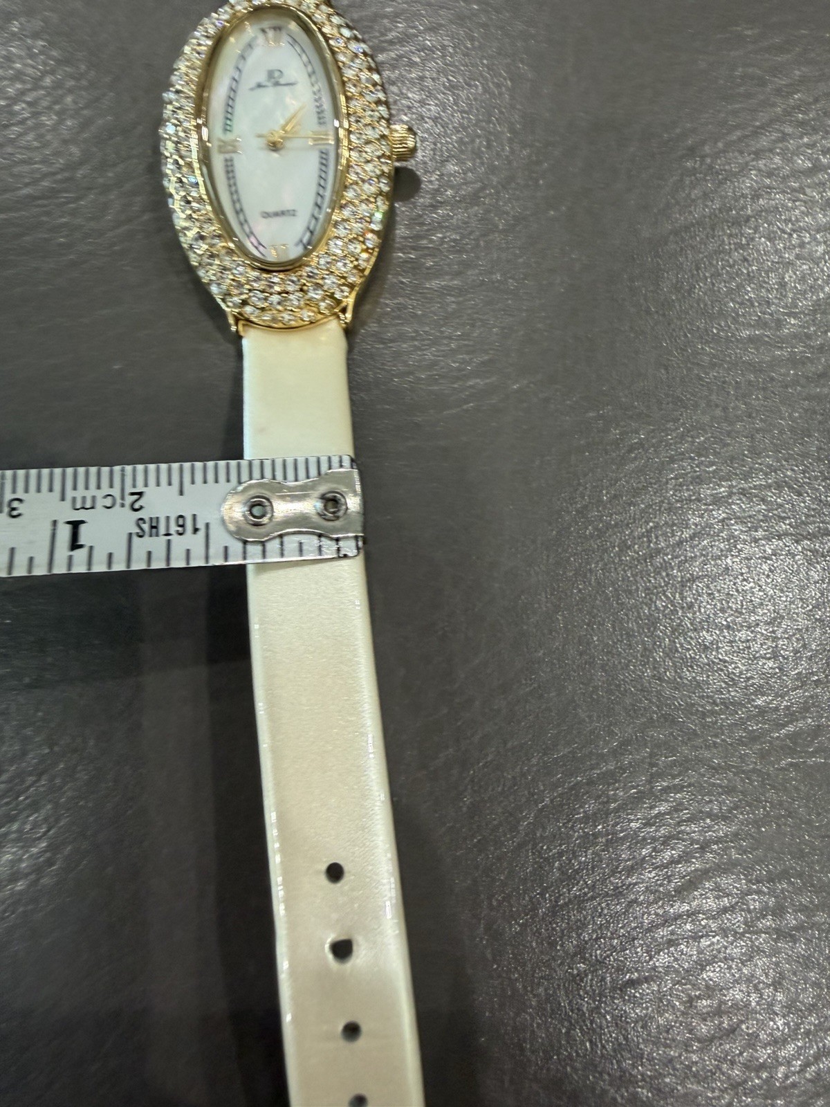 Vintage Jean Dousset Leather, Rhinestone Watch With Beige oval face.