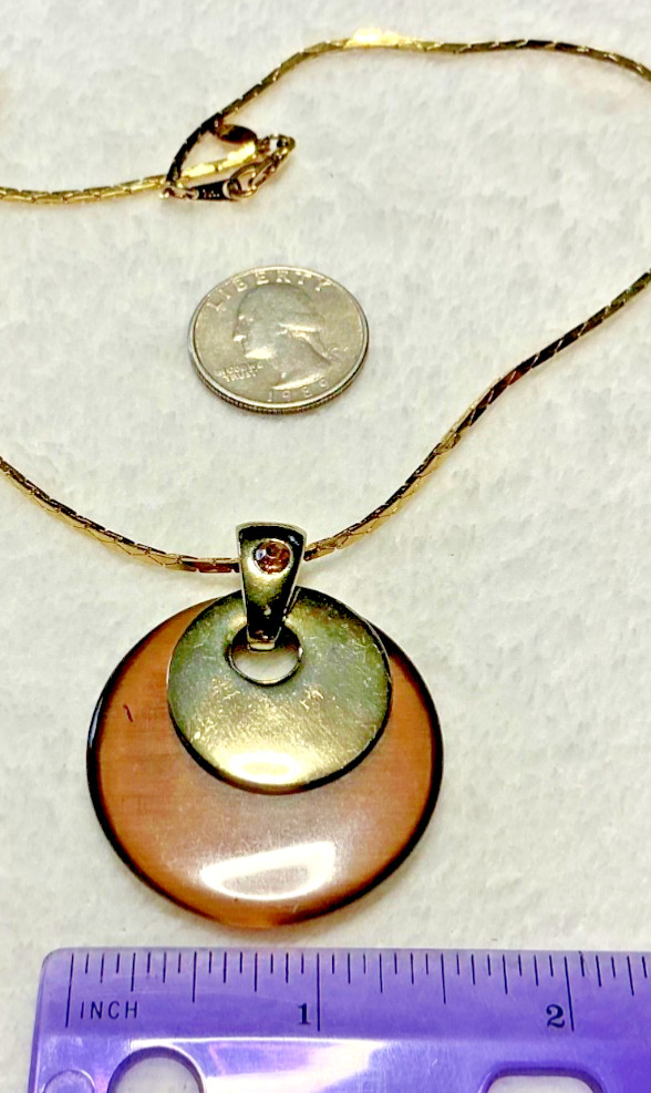 Vintage Brown Acrylic Disc Pendant with a brown rhinestone and Gold Tone Chain