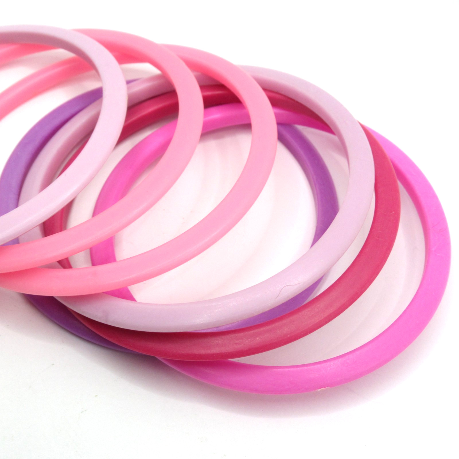 Lot of Seven Thin Plastic Bangle Bracelets Pinks Purples Plums Shades Vintage