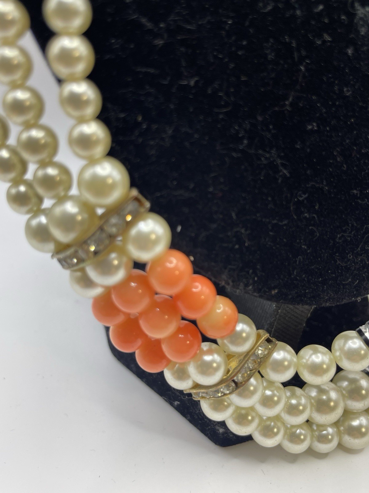Vintage ivory and coral triple strand pearl necklace with gold tone clasp 20”