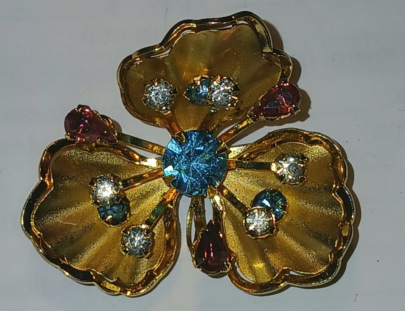 Vintage flower brooch/ pin with multi color rhinestones in gold metal setting