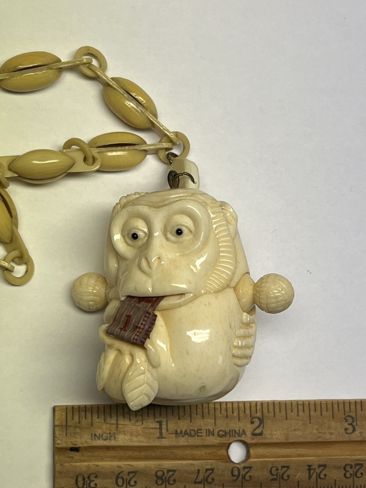 ANTIQUE ART DECO MONKEY NECKLACE TAPE MEASURE CELLULOID CHAIN PENDANT WHIMSICAL