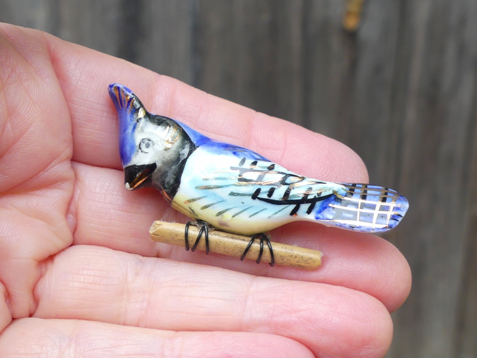 Vintage ceramic blue jay brooch on wood branch bird hand-painted gilt porcelain