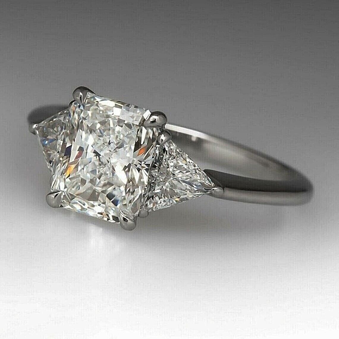 New Remarkable Radiant Cut Propose Ring in Silver Three-stone Engagement Ring
