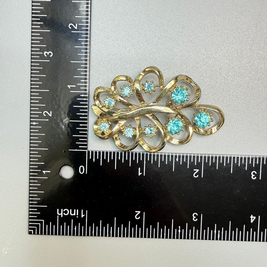 Vintage Coro Gold Tone Blue Rhinestone Brooch Leaf Ribbon Swirl