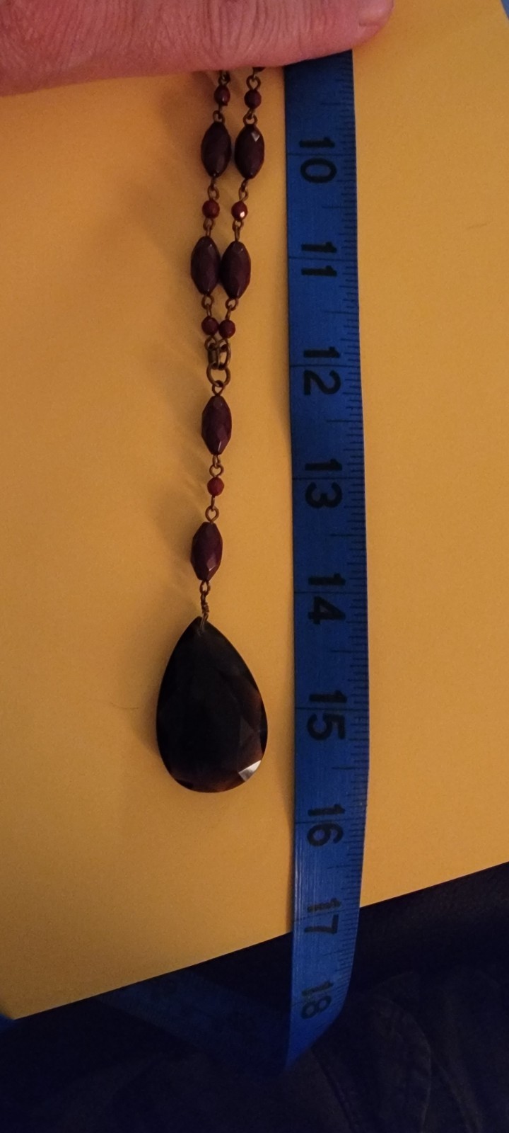 Faceted teardrop pendant necklace crafted with a distinctive vintage aesthetic