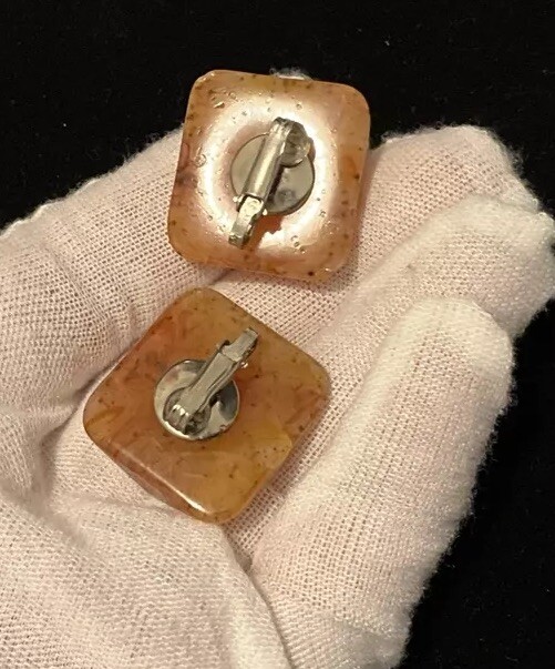 Bakelite Carved Apple Juice Clip On Earings About I 1/4 Inch Across 3/8 Thick.