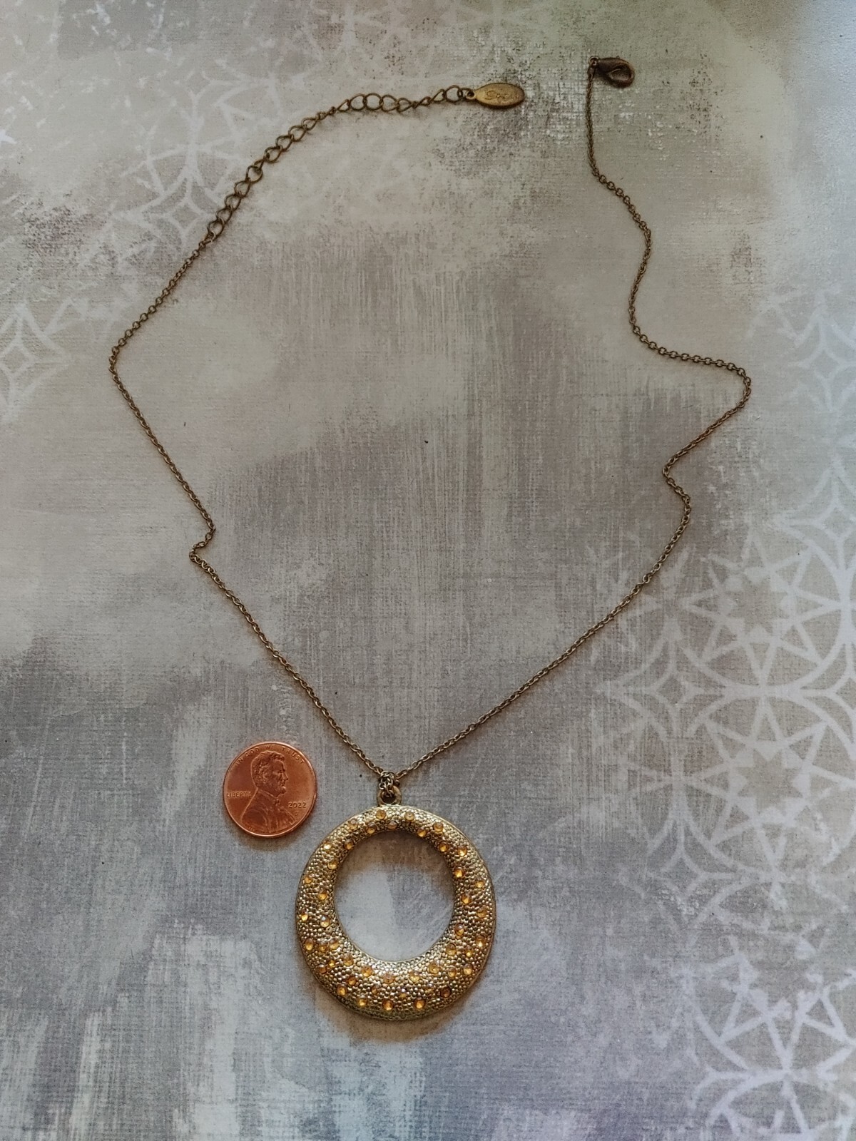 Vintage necklace gold tone metal circle yellow rhinestone signed Gwen